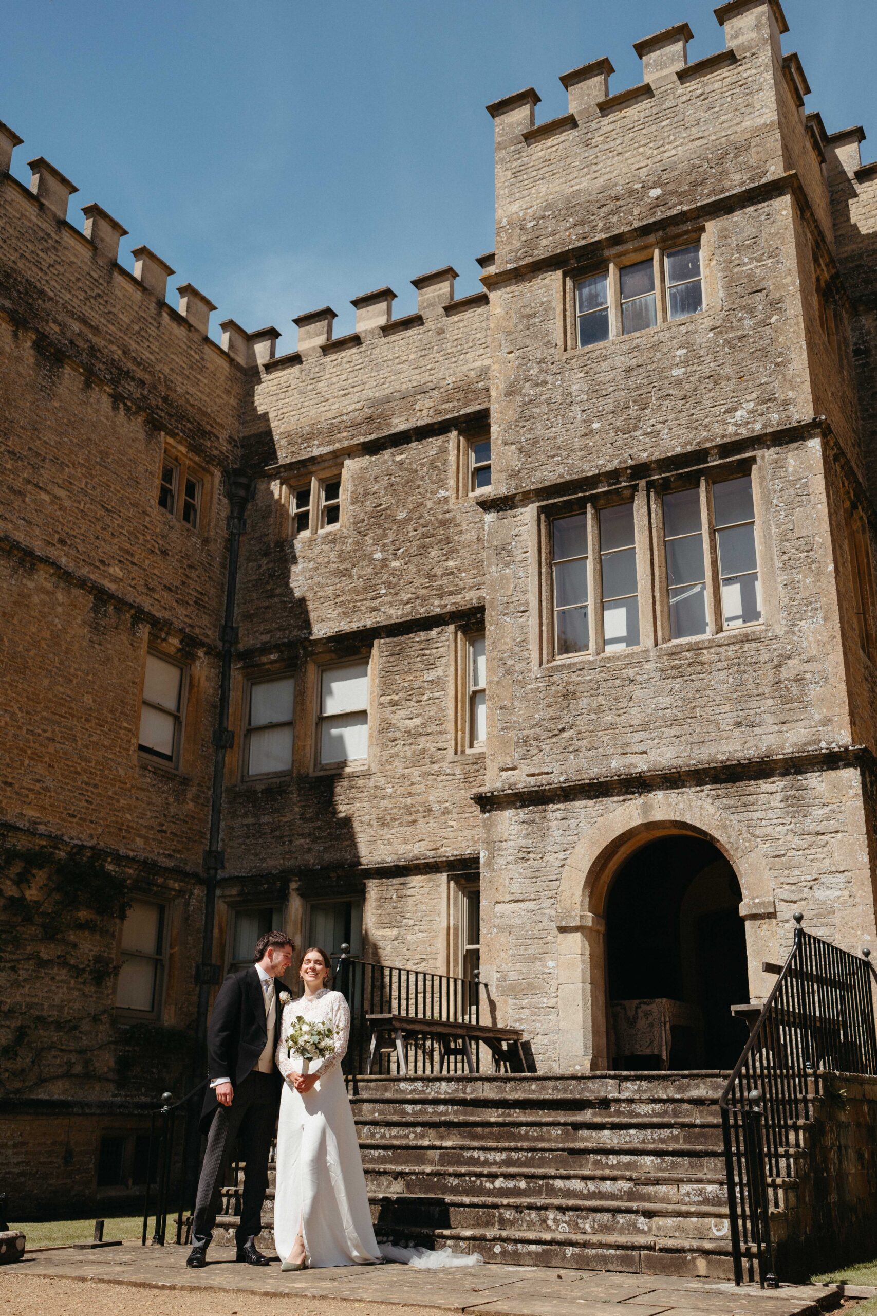 Bride and groom at the entrance of Rousham House on their Oxfordshire wedding day