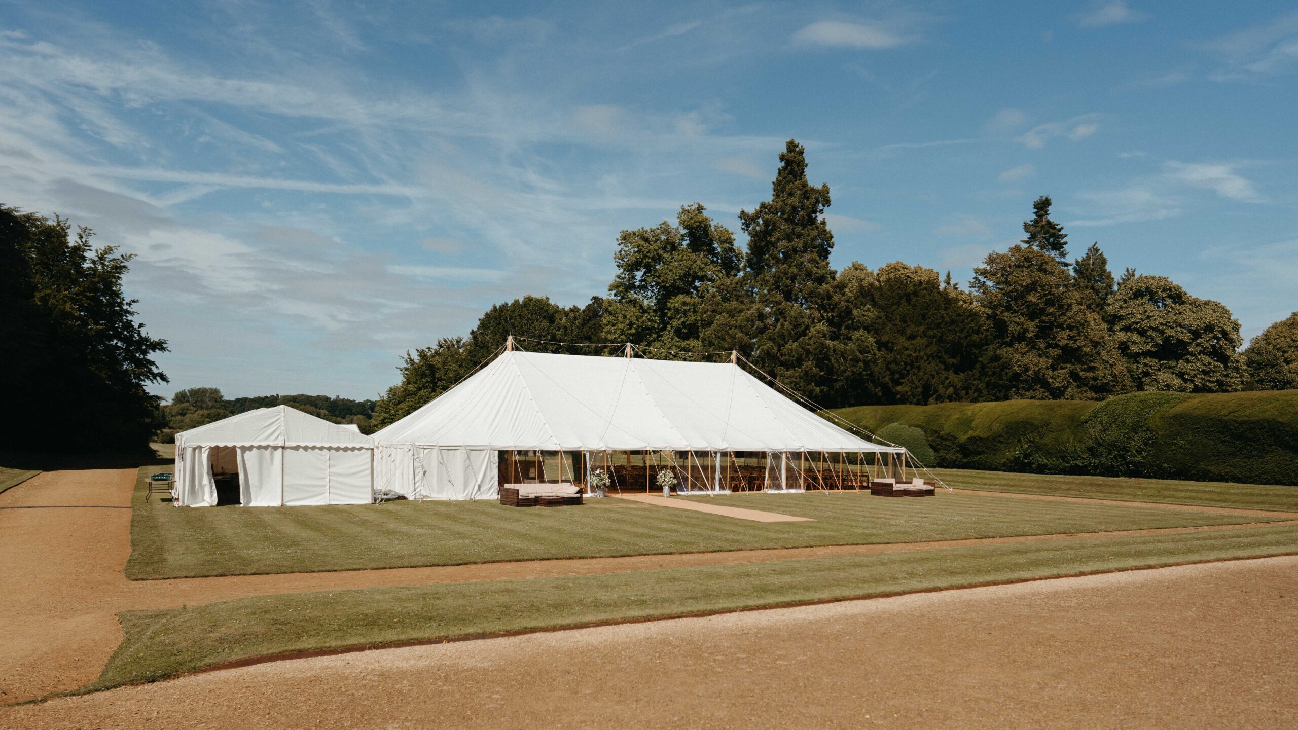 White pole marquee set up on the lawn at Rousham House for an Oxfordshire wedding reception
